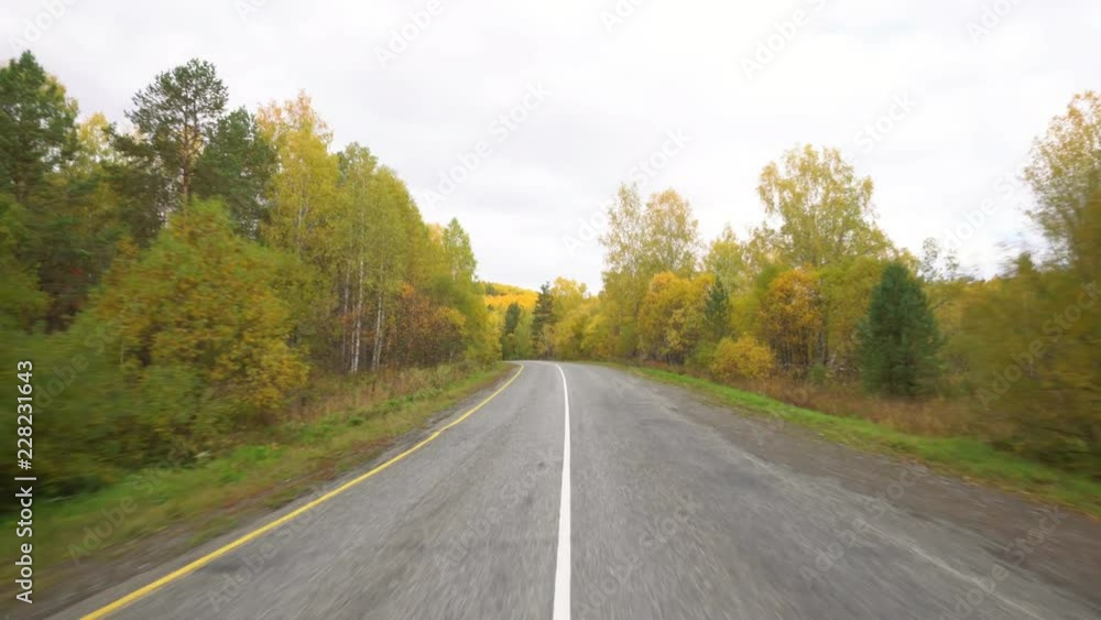 Beautiful mountain road. Movement of the camera. Blue sky and clouds. Beautiful mountain road. Movement of the camera. Blue sky and clouds.
