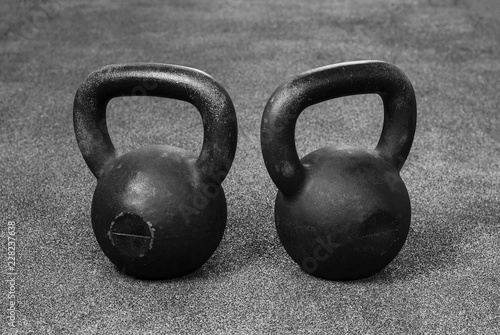 two heavy kettlebell black on gray background
