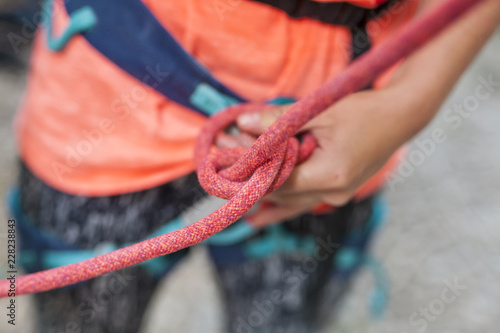 A climber knits a knot.