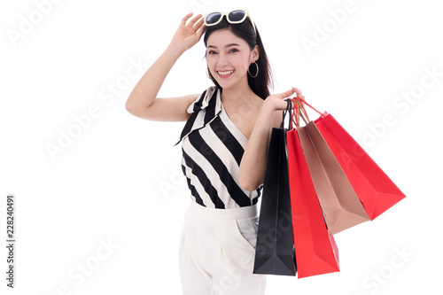 happy young woman holding shopping bag isolated on a white background