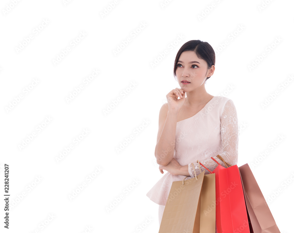 young woman thinking and holding shopping bag isolated on white background young woman thinking and holding shopping bag isolated on white background