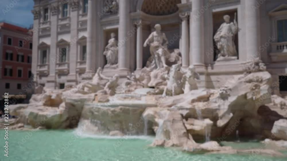 Blurred view of large Baroque fountain with sculptures in Rome Blurred view of large Baroque fountain with sculptures in Rome