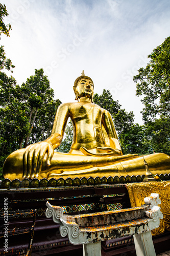 Beautiful golden Buddha statue in Analyo Thipayaram temple photo