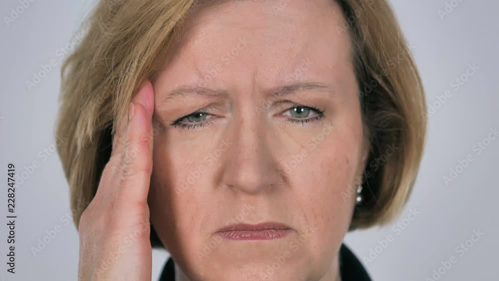 Close Up of Old Woman Face Gesturing Headache, Stress Close Up of Old Woman Face Gesturing Headache, Stress