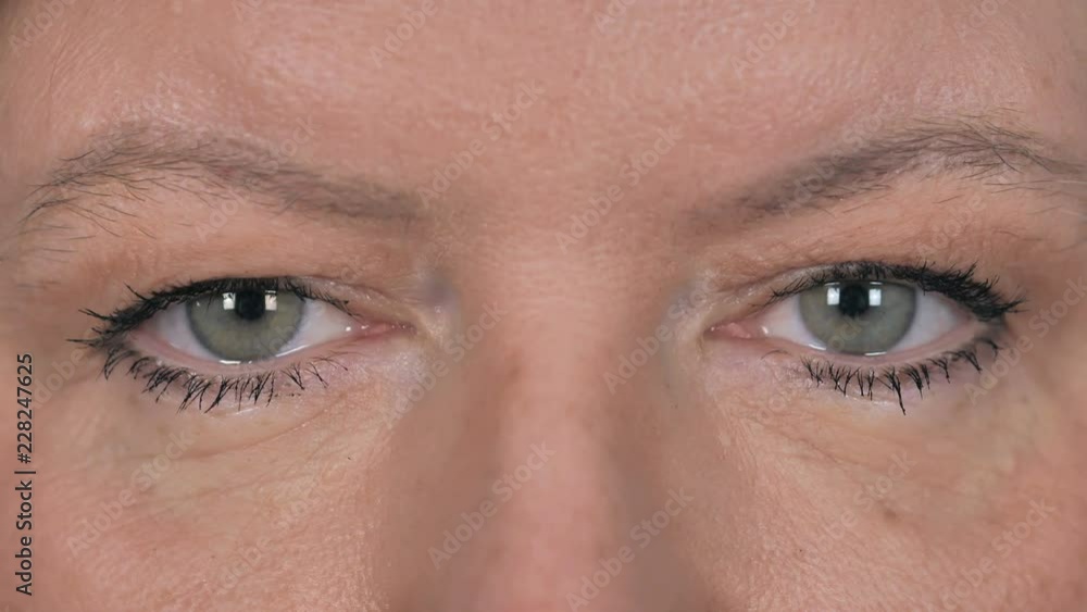 Close Up of Blinking Beautiful Eyes of Old Woman Close Up of Blinking Beautiful Eyes of Old Woman