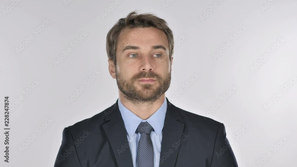Serious Businessman Looking at Camera in Studio on White Background Serious Businessman Looking at Camera in Studio on White Background