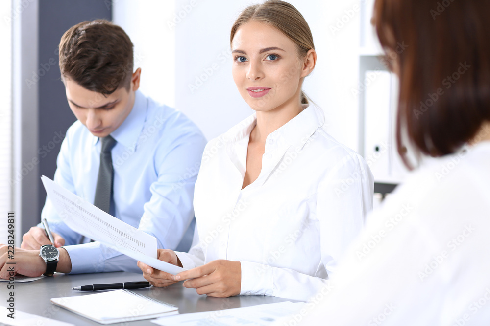 Group of business people or lawyers discussing terms of transaction in office. Meeting and teamwork concept Group of business people or lawyers discussing terms of transaction in office. Meeting and teamwork concept