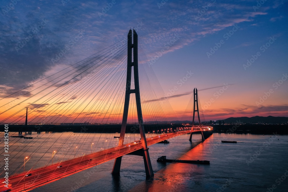 Obraz premium Sunset at The Third Nanjing Yangtze River Bridge Seen From A Drone