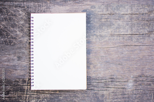 blank notebook on wooden background. soft focus.