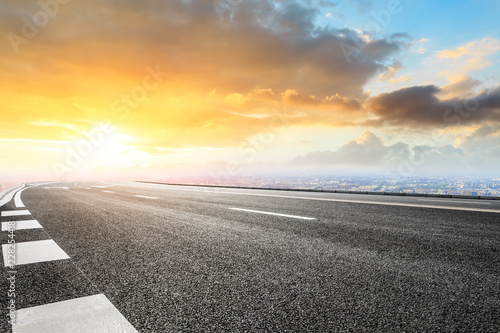 Panoramic city skyline and buildings with empty asphalt road © ABCDstock