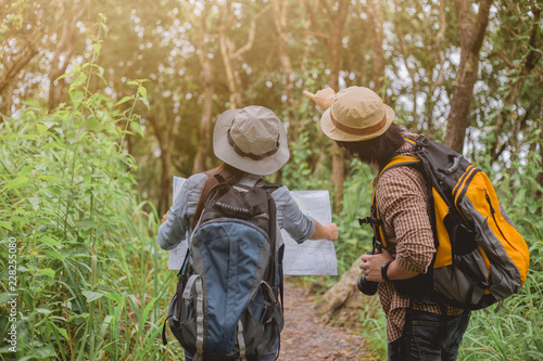 Two Young Tourists With Backpacks Sightseeing nature