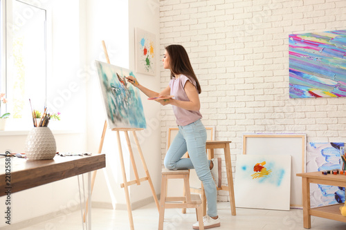 Female artist painting pict...