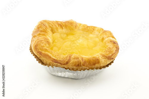 Apple danish pastry in aluminium foil cup on white background