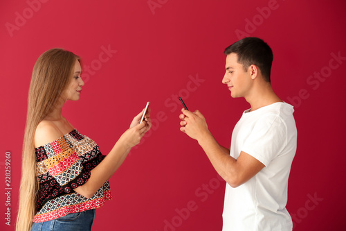 Young couple with mobile ph...