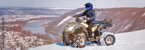 Travel in the winter on the ATV. Beautiful winter nature. photo