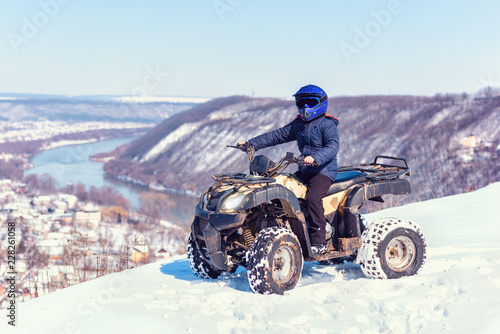 Travel in the winter on the ATV. Beautiful winter nature. photo