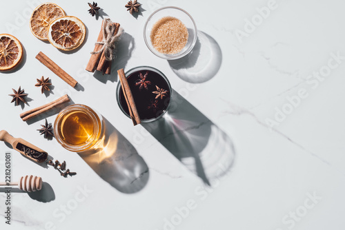 top view of ingredients for mulled wine on white tabletop