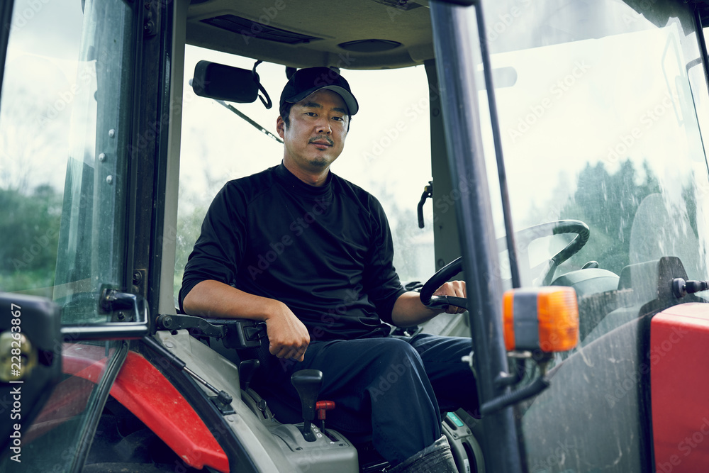 Portrait of man in tractor Portrait of man in tractor