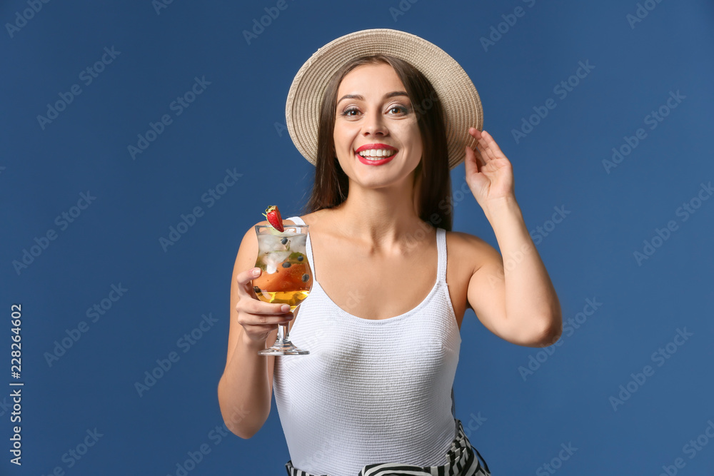 Beautiful woman with tasty summer cocktail on color background Beautiful woman with tasty summer cocktail on color background