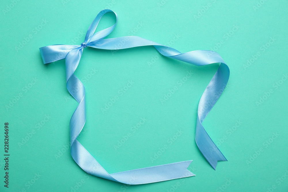 Frame made of blue ribbon on color background Frame made of blue ribbon on color background