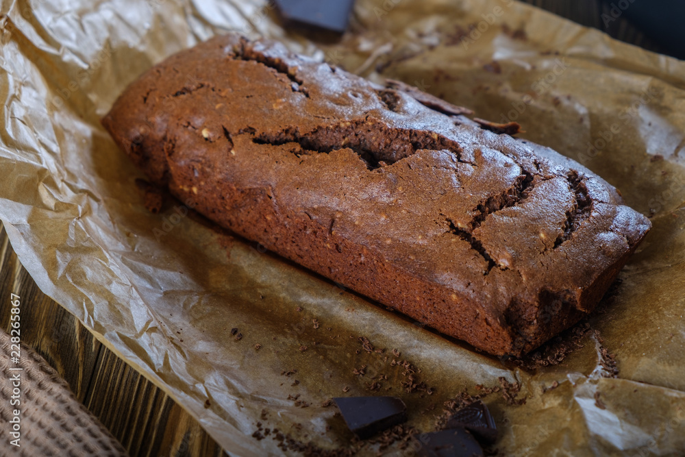 Fresh brownie from the oven on a wooden table Fresh brownie from the oven on a wooden table