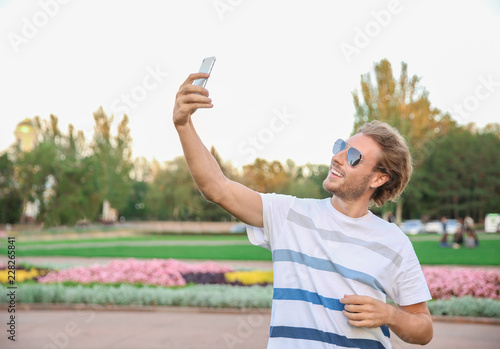 Handsome young man taking s...