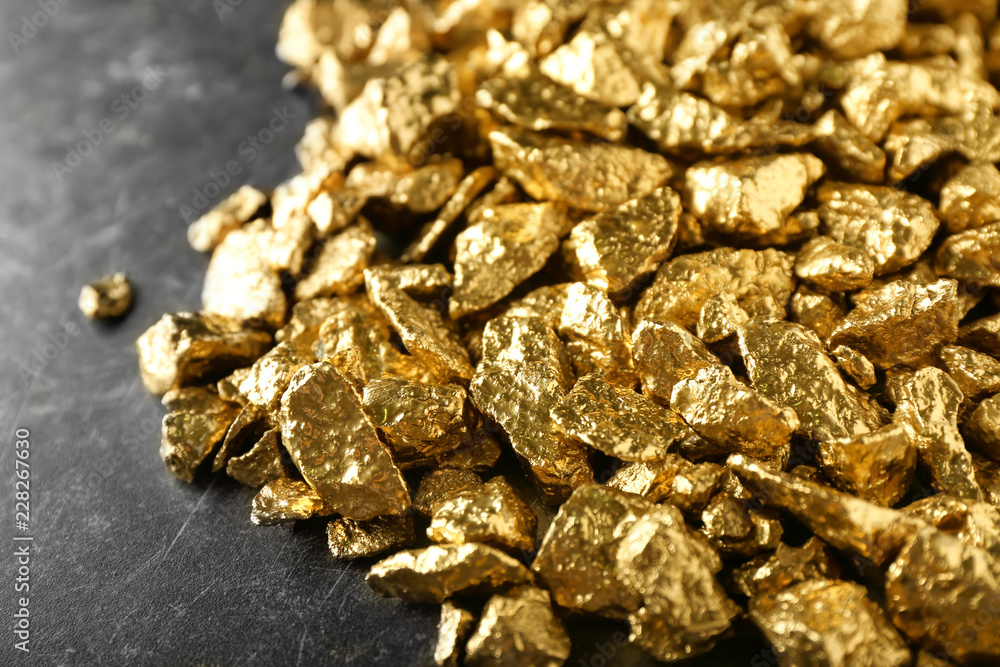 Many gold nuggets on table Many gold nuggets on table