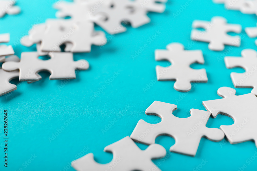 Pieces of jigsaw puzzle on color background Pieces of jigsaw puzzle on color background