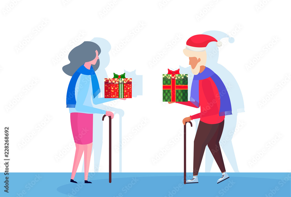 Senior couple with stick giving each other Senior couple with stick giving each other
