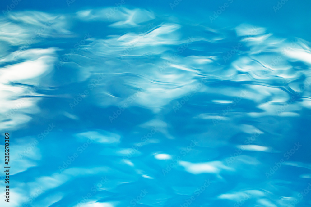 The smooth natural blue water background with bokeh abstract on the sea or ocean,vintage and soft colored blur. The smooth natural blue water background with bokeh abstract on the sea or ocean,vintage and soft colored blur.