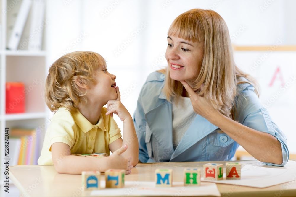 Cute kid boy at speech therapist office Cute kid boy at speech therapist office