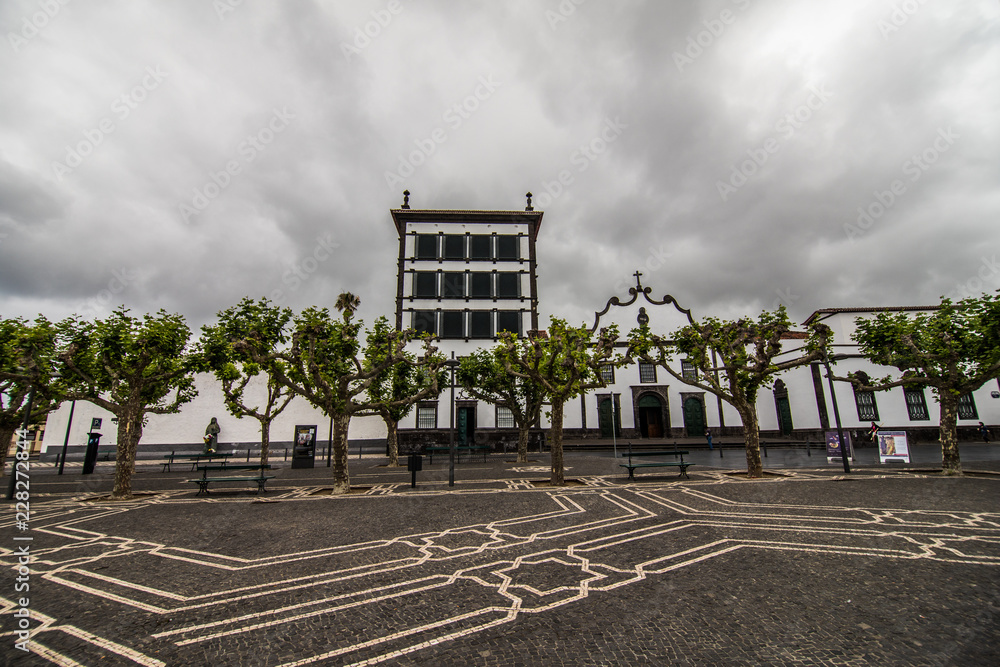 Obraz premium PONTA DELGADA, PORTUGAL - July, 2018: City Gates at the historical center of Ponta Delgada, the capital of Azores Islands.