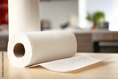 Rolls of paper towels on kitchen table