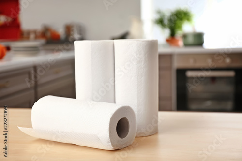 Rolls of paper towels on kitchen table photo