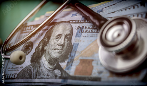 phonendoscope on American tickets, concept of sanitary copayment