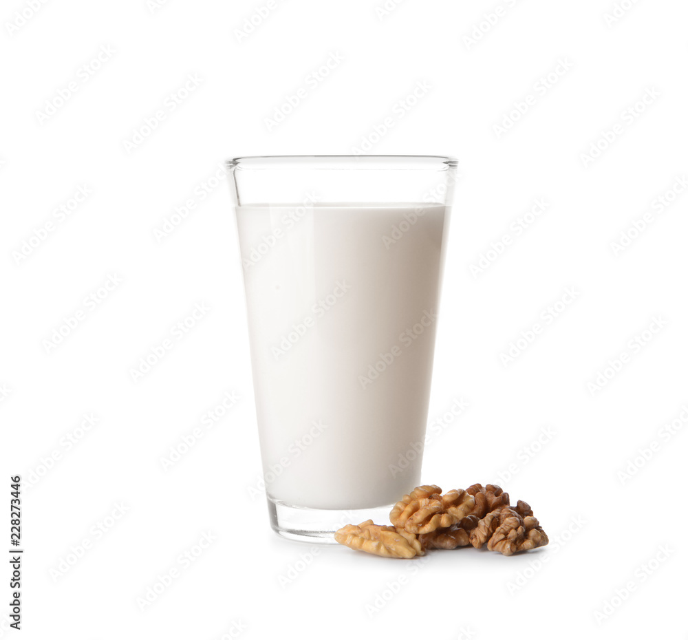 Glass of milk and walnuts on white background Glass of milk and walnuts on white background