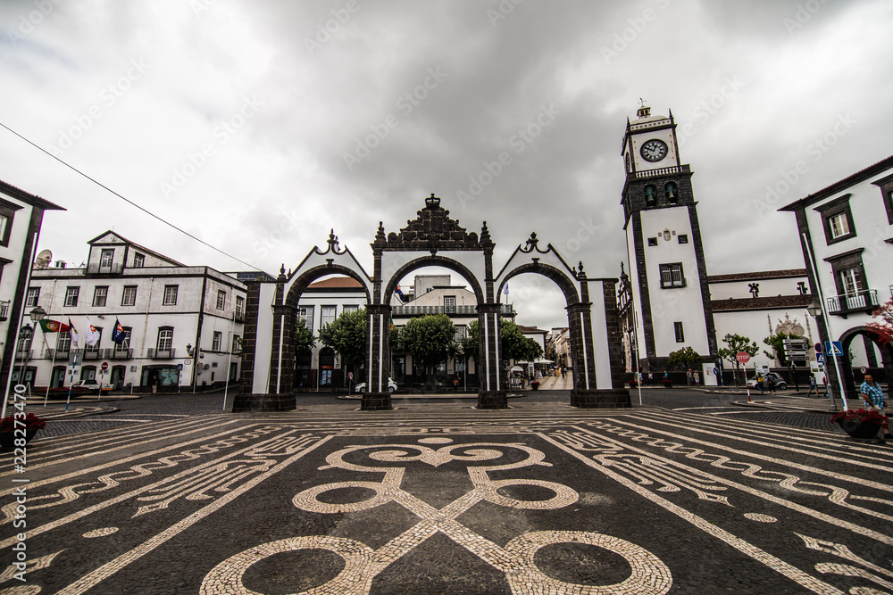 Ponta Delgada, Azores, Portugal - July, 2018: Portas da Cidade Gates to the City historic entrance to the town of Ponta Delgada on Sao Miguel island, Azores