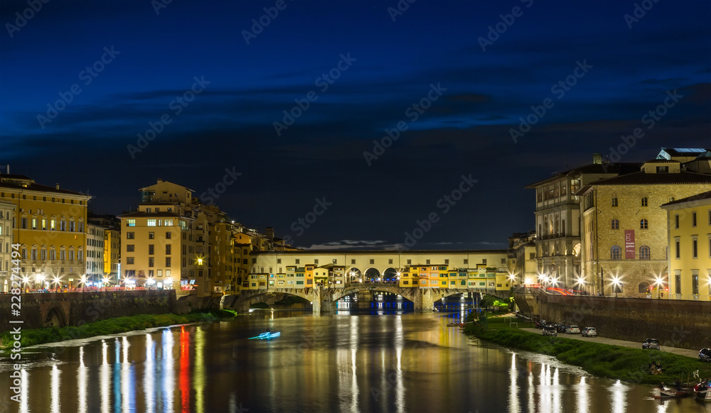 Sunset over bridges through  river Arno in Florence