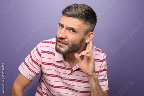 Handsome man with hearing p...