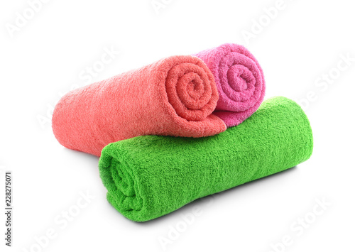 Rolled terry towels on white background