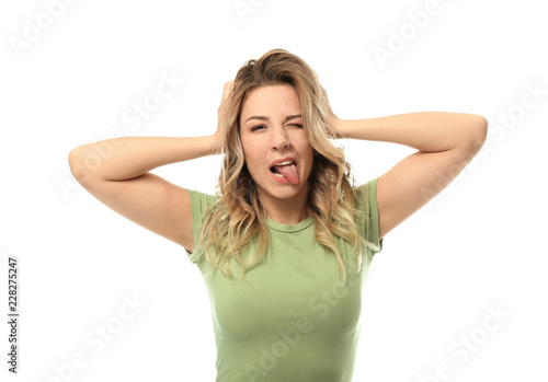 Funny portrait of beautiful young woman on white background