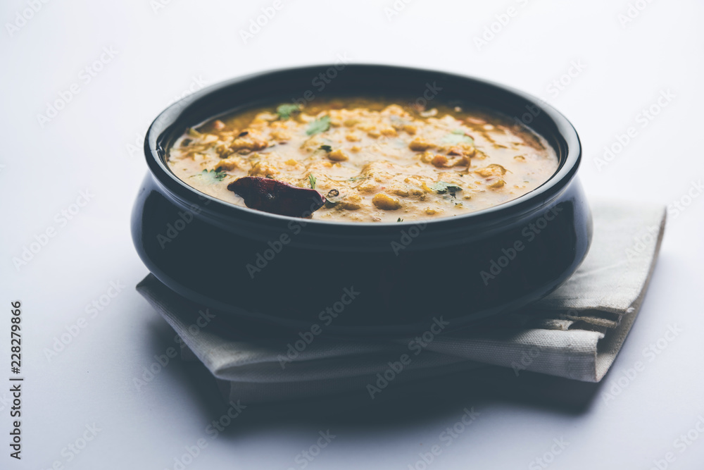 Dal Tadka Fry / Indian Lentil Curry served in a bowl with rice and roti, selective focus Dal Tadka Fry / Indian Lentil Curry served in a bowl with rice and roti, selective focus