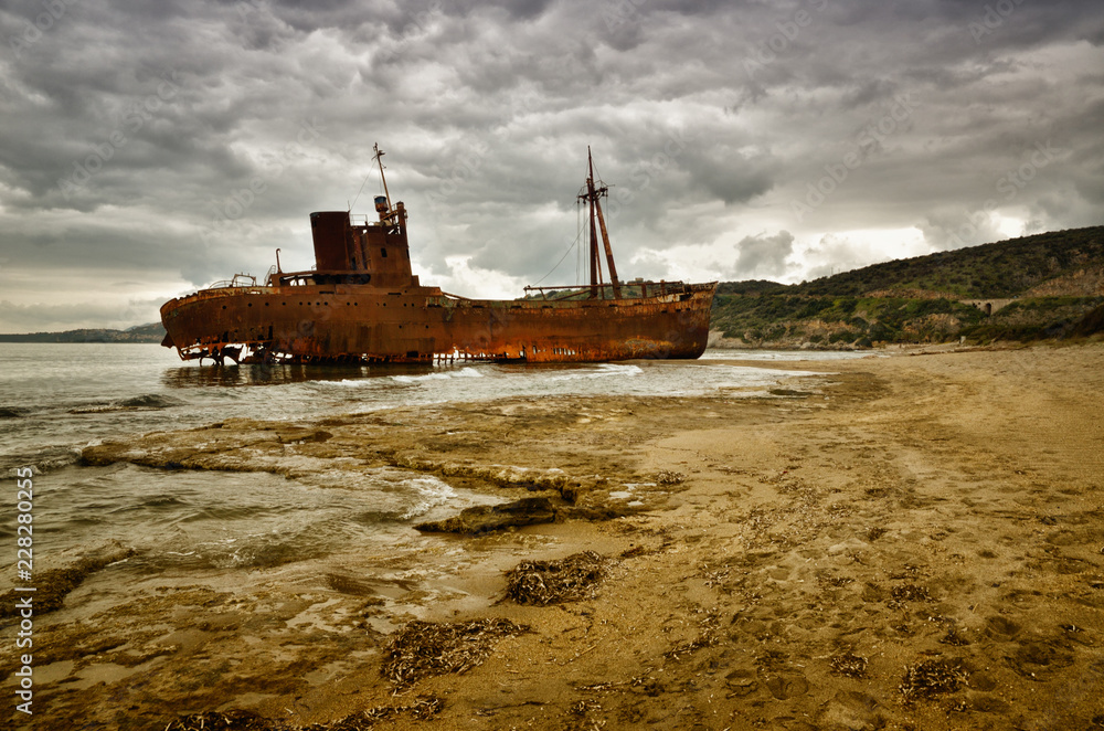 Dimitrios is an old ship wrecked on the Greek coast and abandoned on the beach Dimitrios is an old ship wrecked on the Greek coast and abandoned on the beach