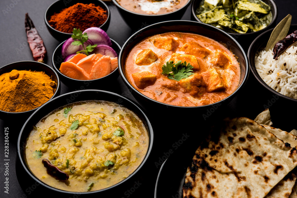 Indian Lunch / Dinner main course food in group includes Paneer Butter Masala, Dal Makhani, Palak Paneer, Roti, Rice etc, Selective focus Indian Lunch / Dinner main course food in group includes Paneer Butter Masala, Dal Makhani, Palak Paneer, Roti, Rice etc, Selective focus