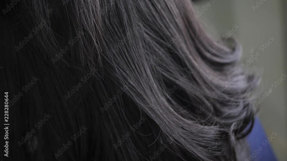 hairdresser using spray setting hairstyle hairdresser using spray setting hairstyle