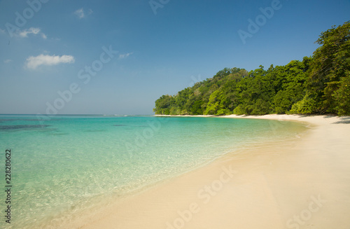 Beach no 7  Havelock  Andaman Islands India  tropical ancient forest  turqouise waters  white sandy beach and clear blue sky.