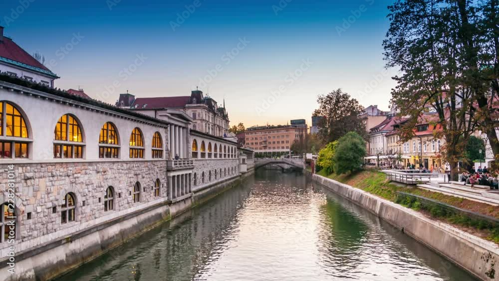 Day to night time lapse video at river Ljubljanica, Ljubljana, Slovenia Day to night time lapse video at river Ljubljanica, Ljubljana, Slovenia