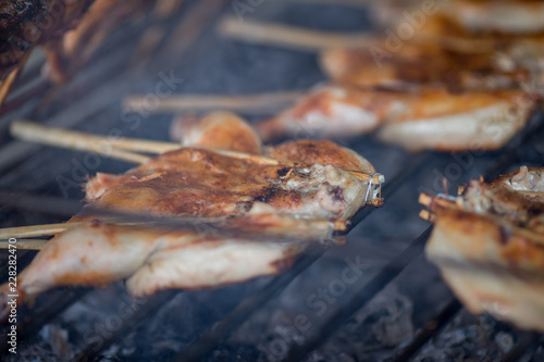 The background of Thai street food, popular with travelers, roasted chicken (kaiyang), papaya salad, roasted with smoke, and makes the food taste fragrant. Eat and taste good.