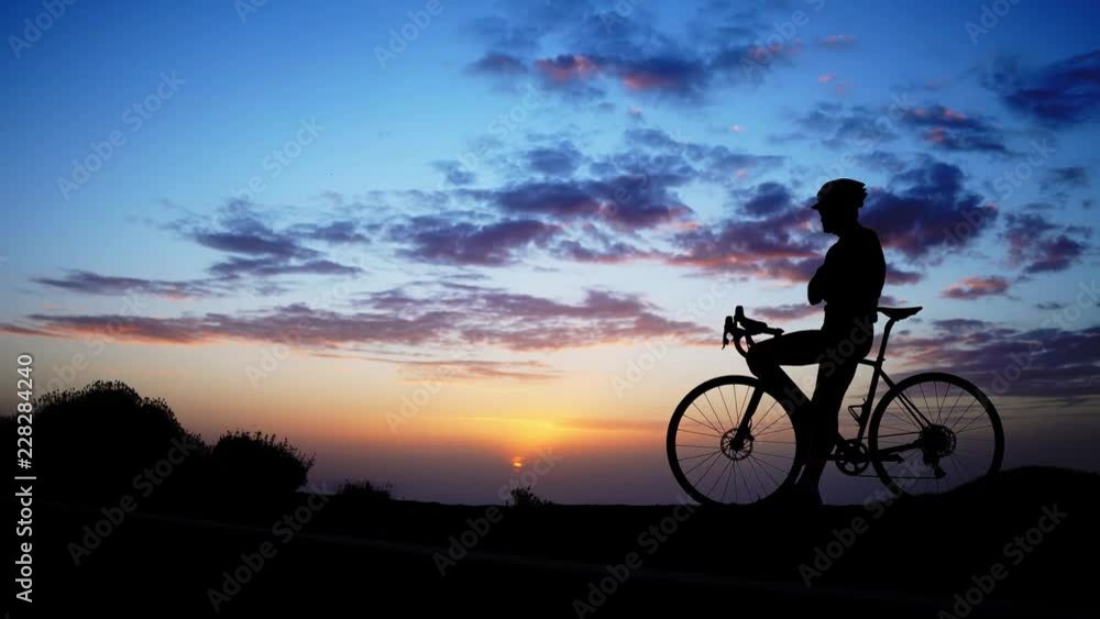 mountain biker silhouette in sunrise mountain biker silhouette in sunrise