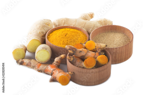heap of ginger and turmeric isolated on white background
